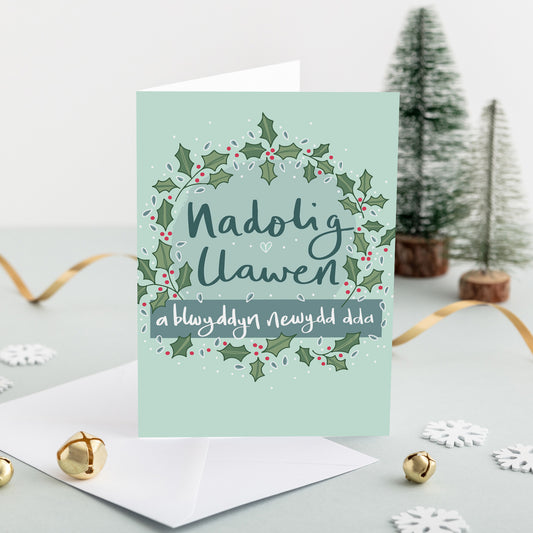 Welsh Christmas card 'Nadolig Llawen a blwyddyn newydd dda' holly wreath