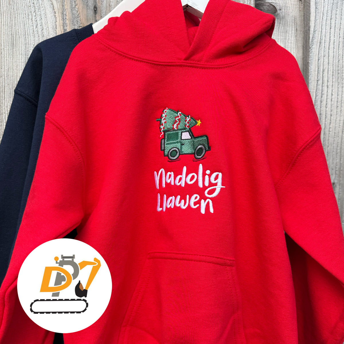 Welsh Christmas hoodie jumper in red featuring an embroidered green Land Rover design